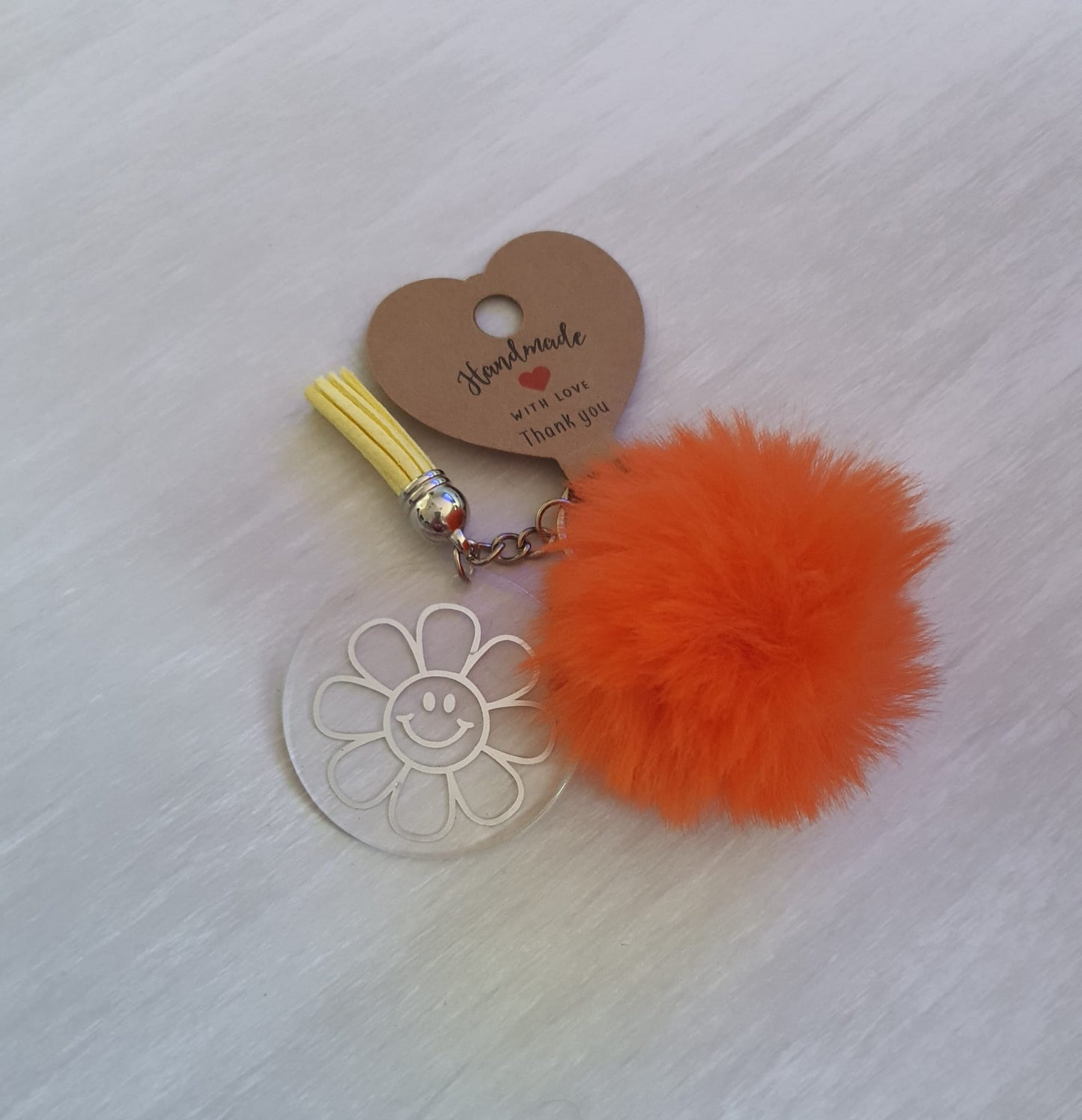 Orange floral pom pom acrylic keyring