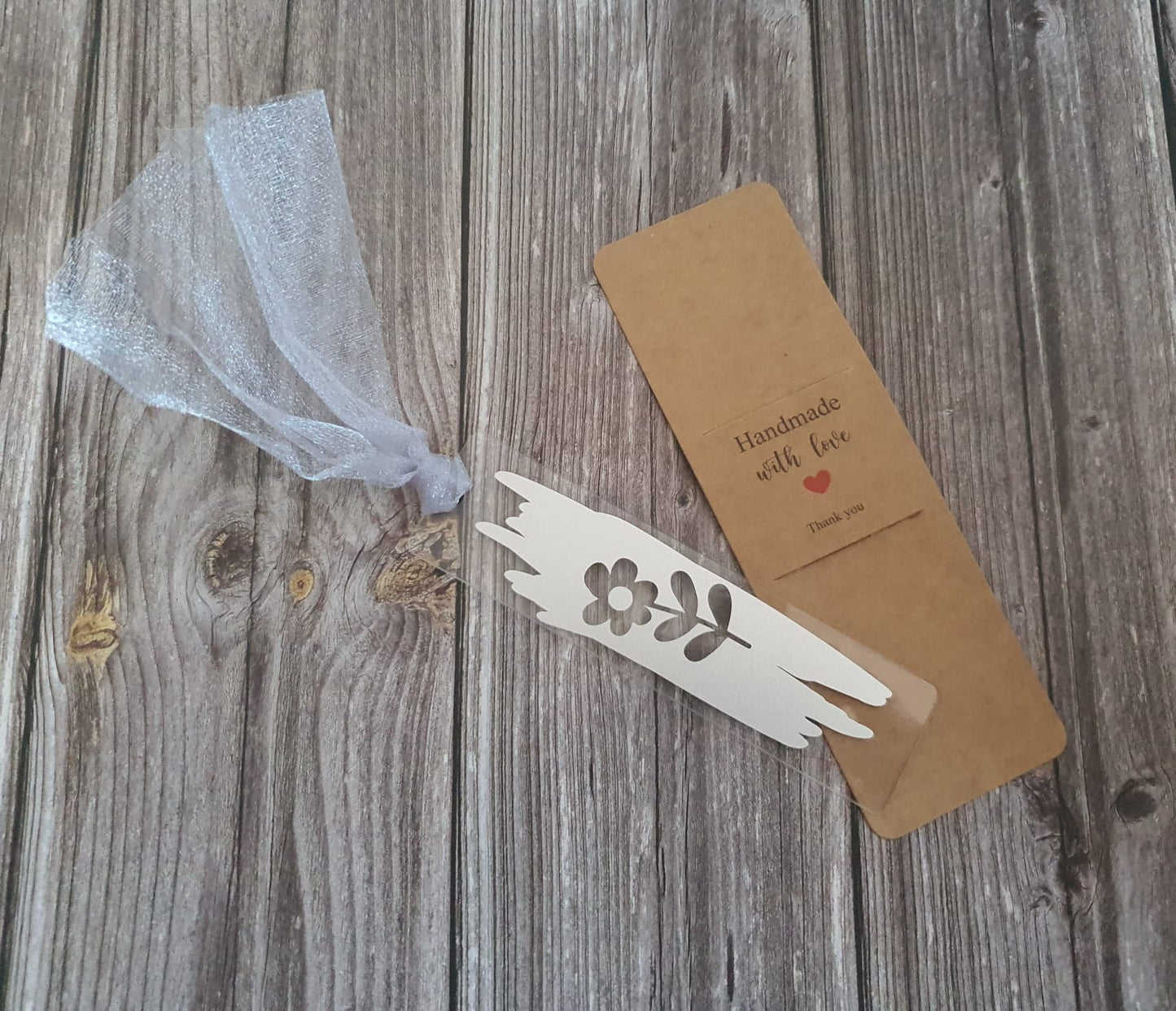 Silver daisy acrylic bookmark with silver tassel
